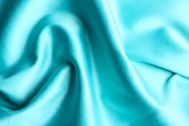 Photo of Texture of delicate light blue fabric as background, closeup