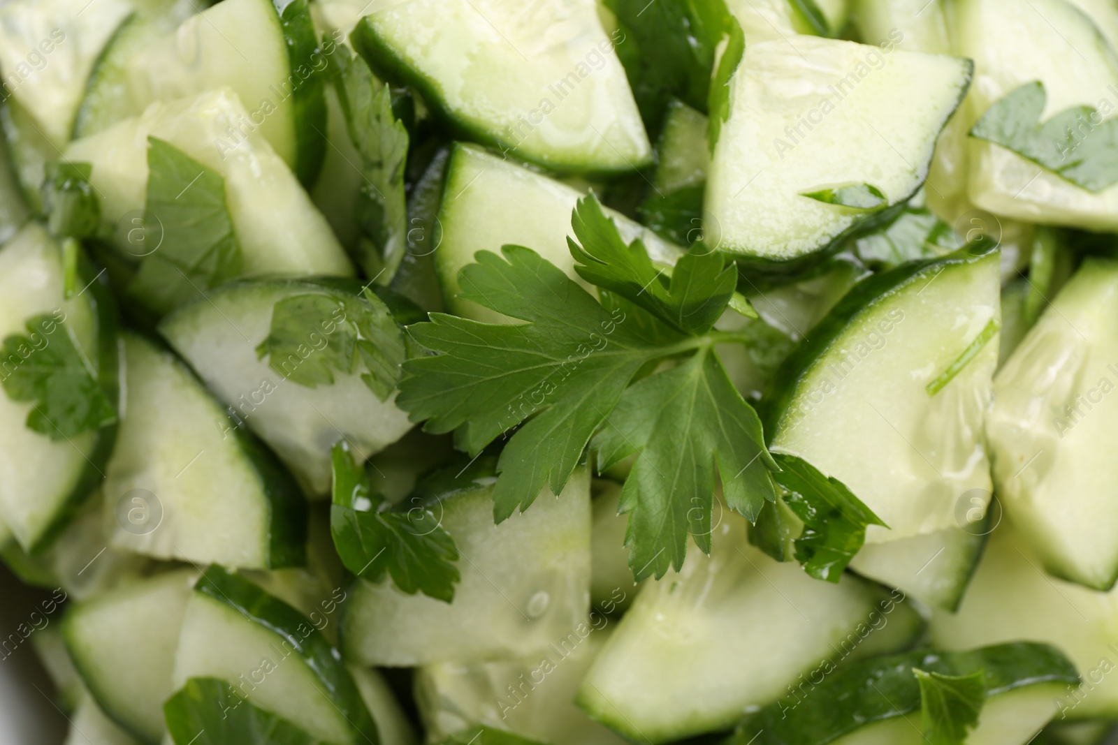 Photo of Delicious cucumber salad as background, top view