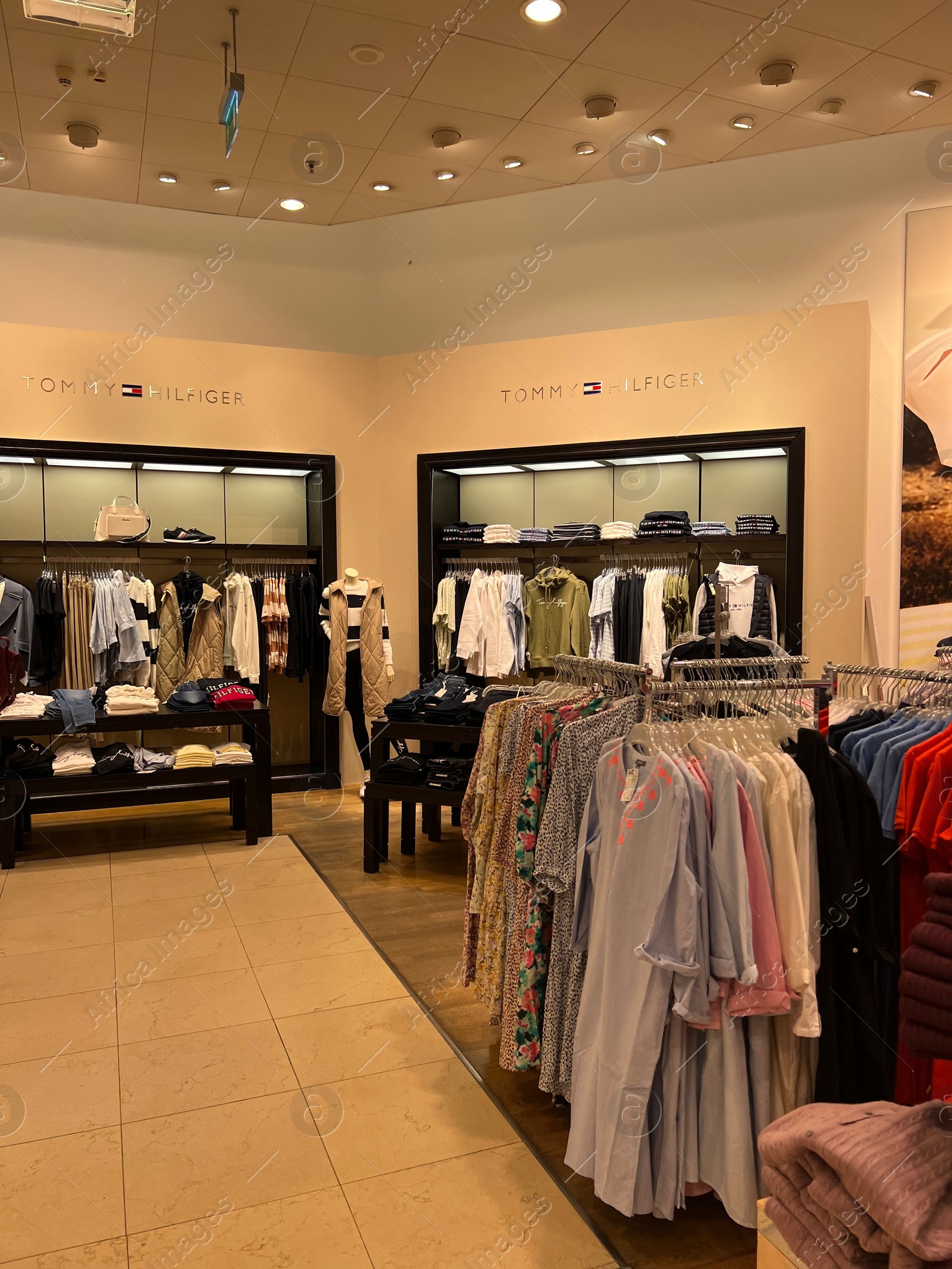 Photo of WARSAW, POLAND - JULY 13, 2022: Stylish interior of Tommy Hilfiger store in shopping mall