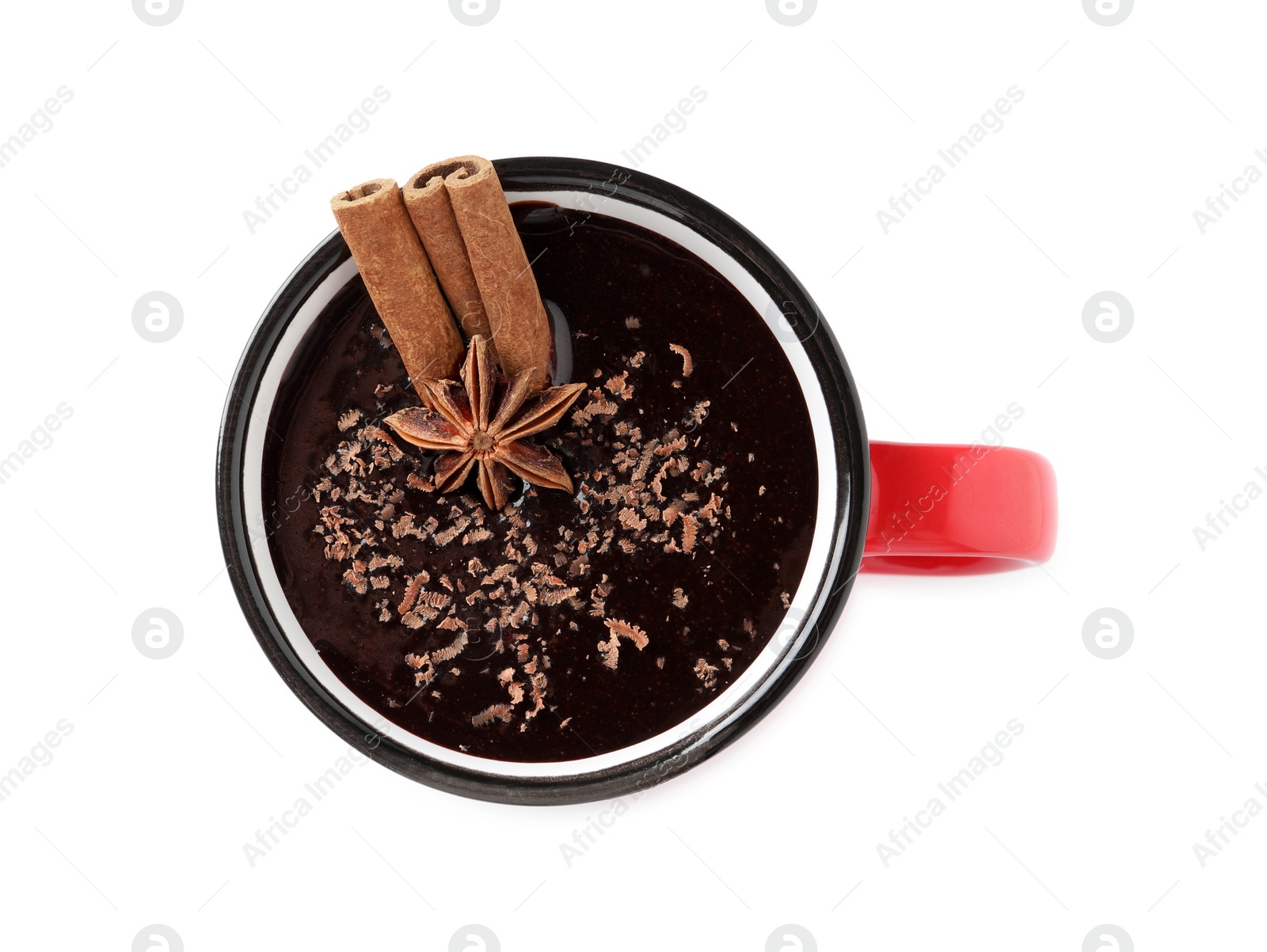 Photo of Yummy hot chocolate with cinnamon and anise in mug isolated on white, top view