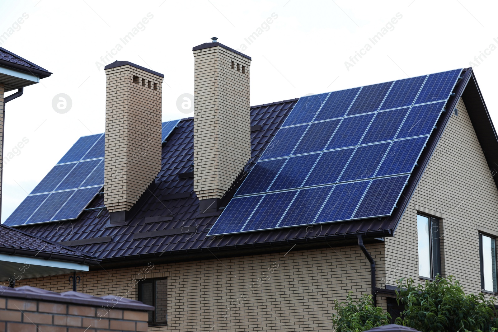 Photo of House with installed solar panels on roof