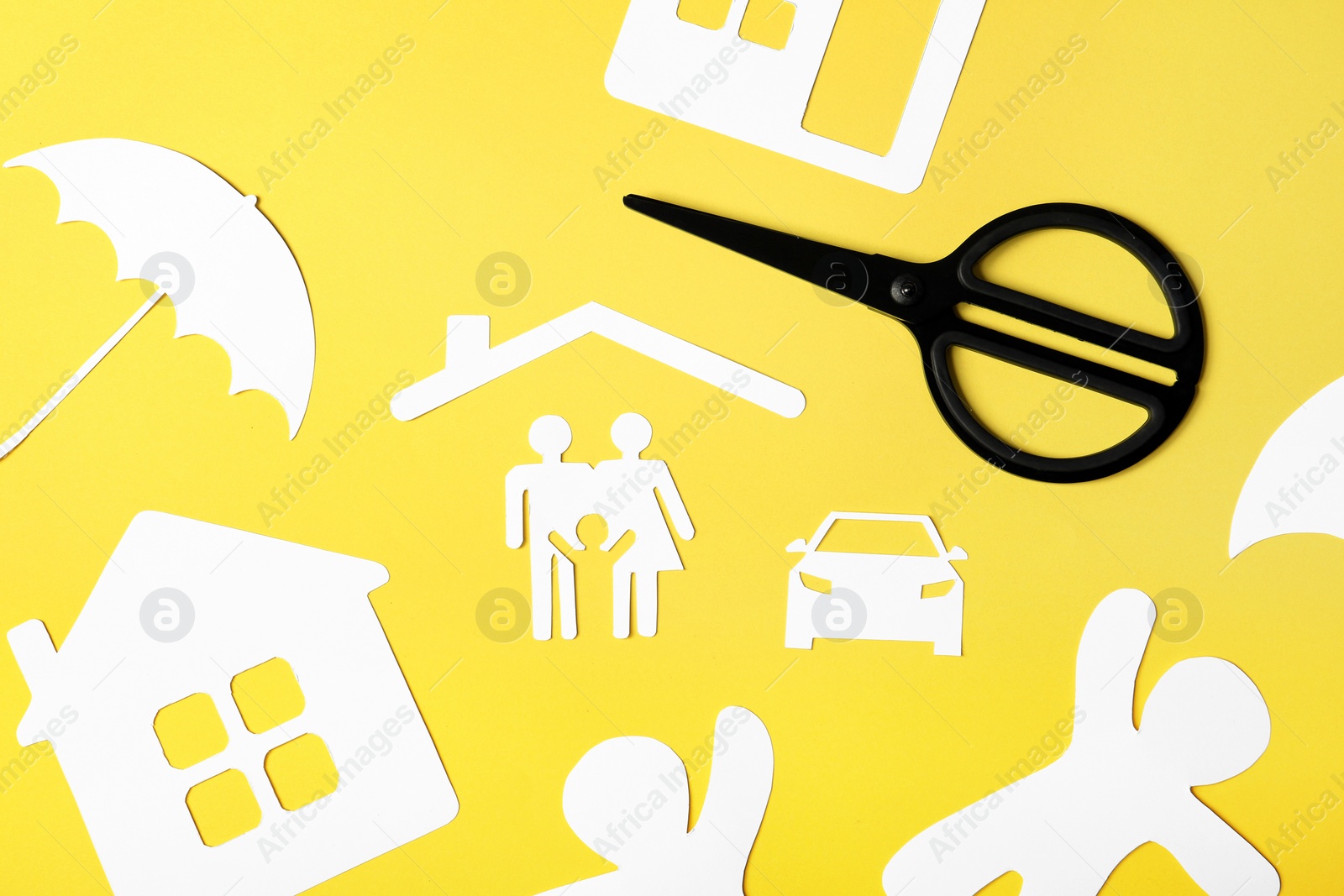 Photo of Flat lay composition with paper silhouette of family and scissors on color background. Life insurance concept