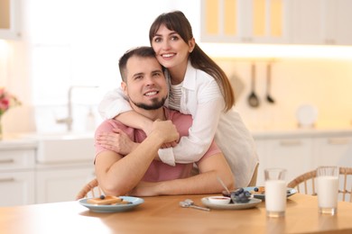 Lovely couple spending time together during breakfast at home