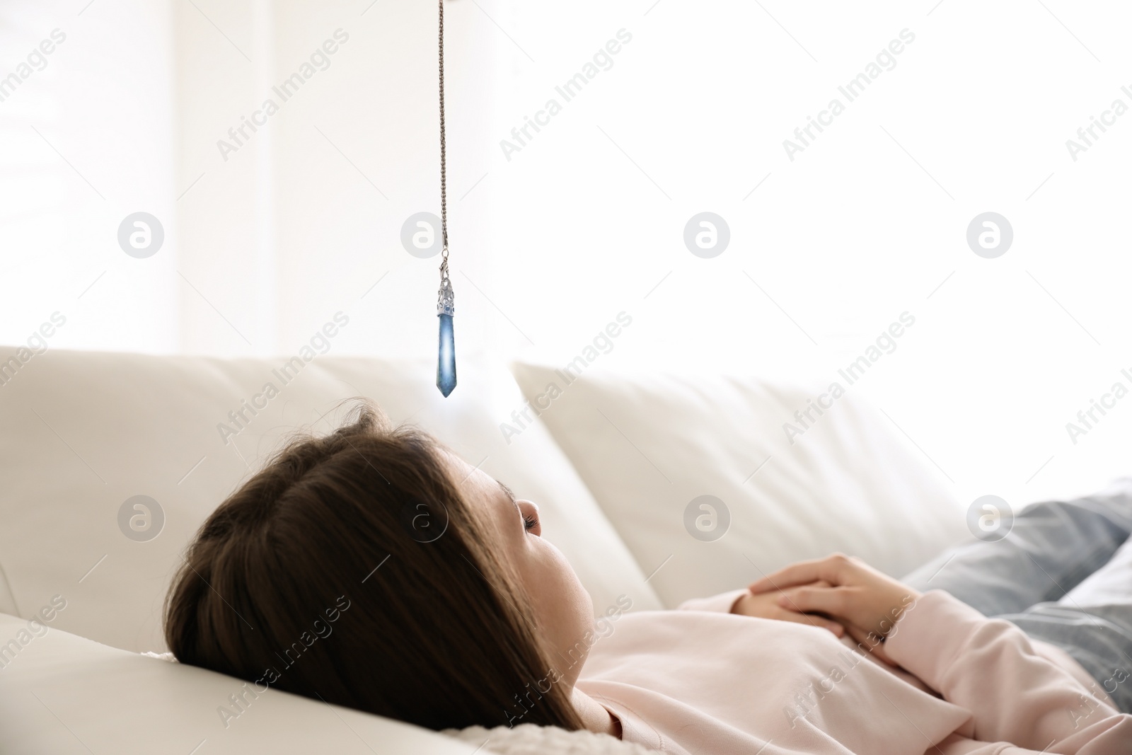 Photo of Patient on sofa during hypnotherapy session in office