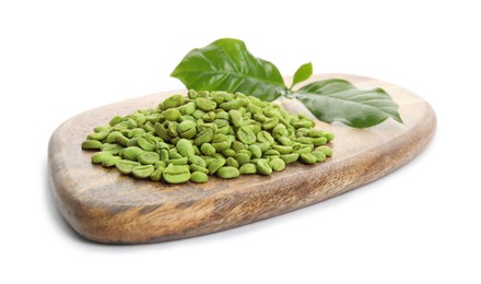 Wooden board with green coffee beans and fresh leaves on white background