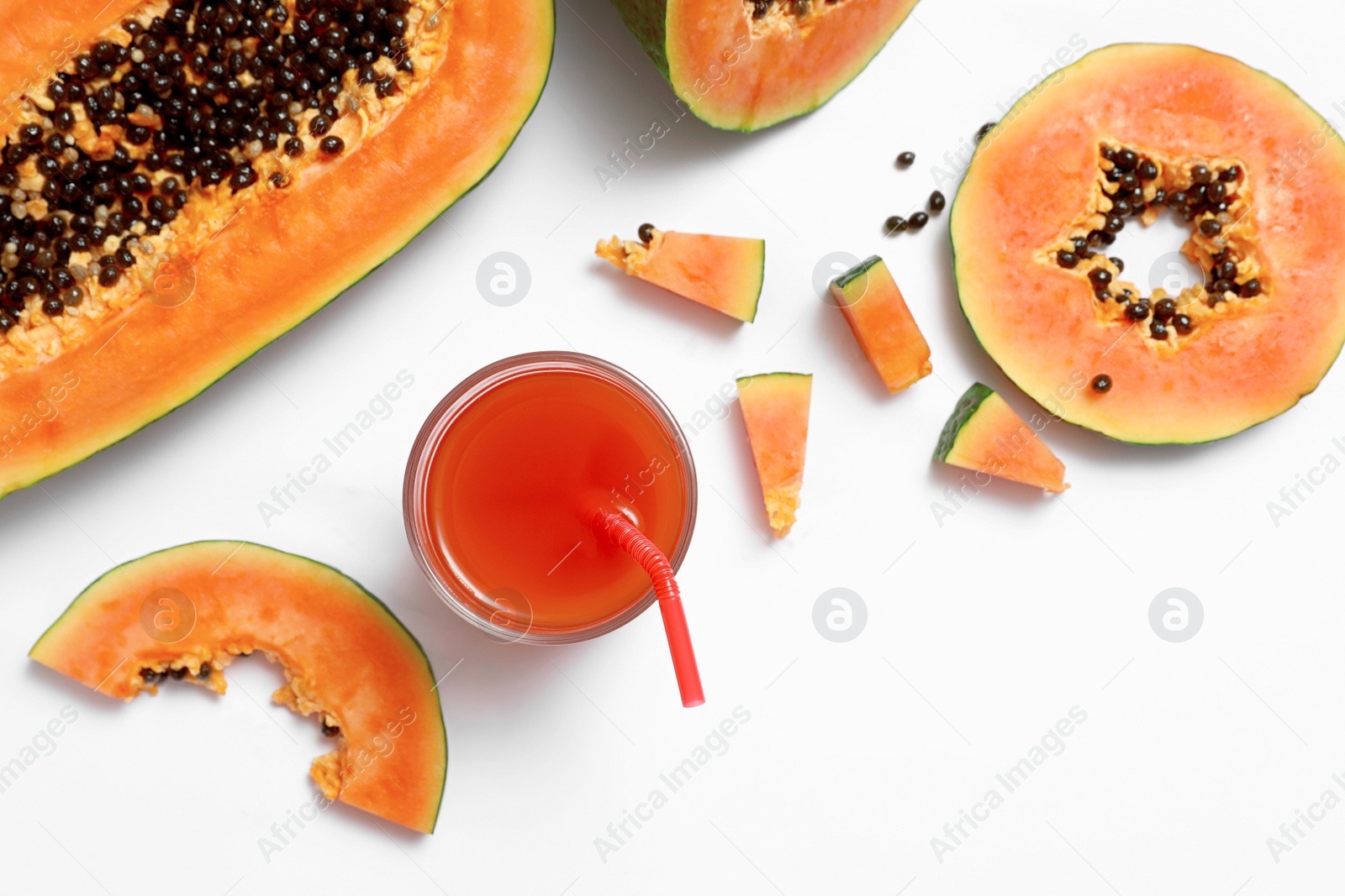 Photo of Composition with fresh cut papaya and juice on white background, top view