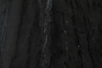 Photo of Black marble surface as background, closeup view