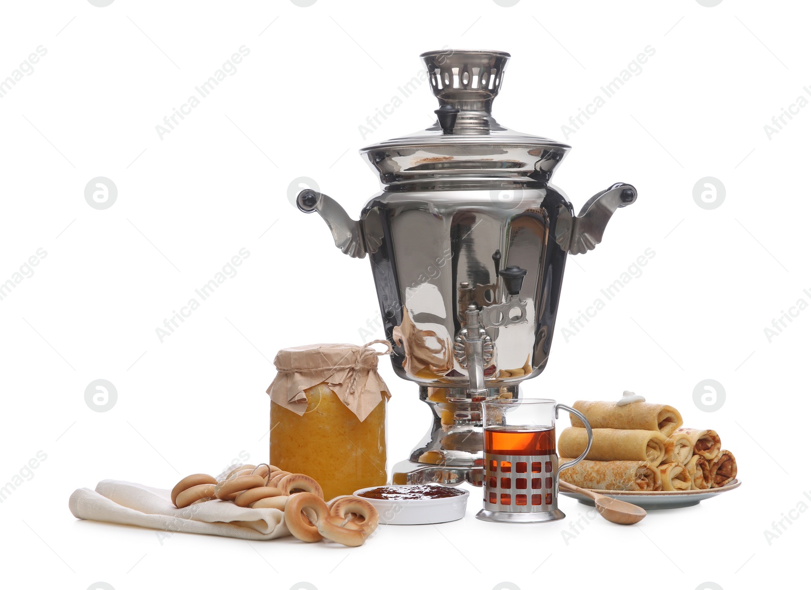 Photo of Traditional Russian samovar and treats on white background