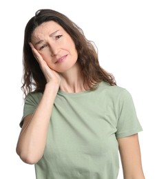 Mature woman suffering from headache on white background