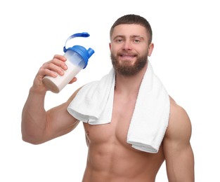 Young man with muscular body holding shaker of protein and towel on white background