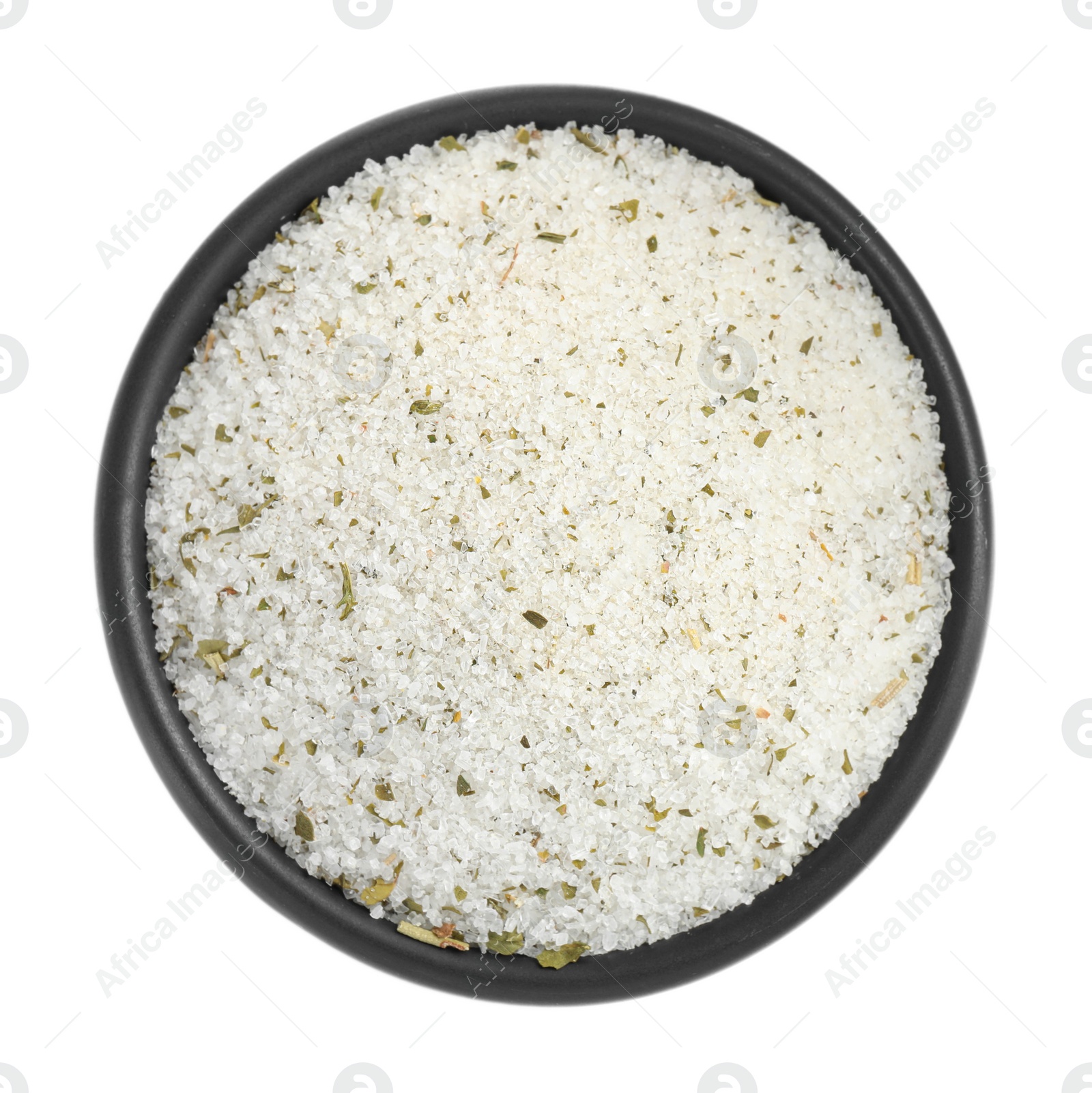 Photo of Natural herb salt in bowl isolated on white, top view