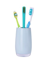 Photo of Different toothbrushes in holder isolated on white