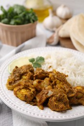 Photo of Delicious chicken curry with rice on table, closeup