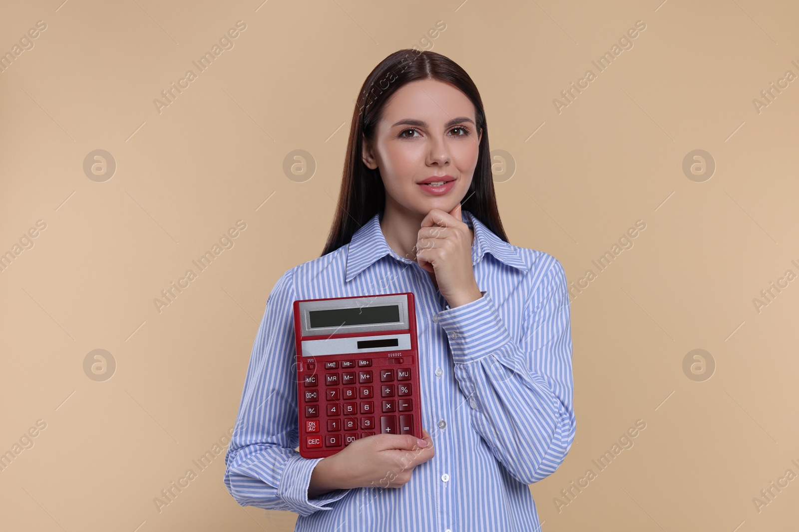 Photo of Thoughtful accountant with calculator on beige background