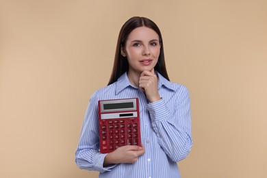 Photo of Thoughtful accountant with calculator on beige background