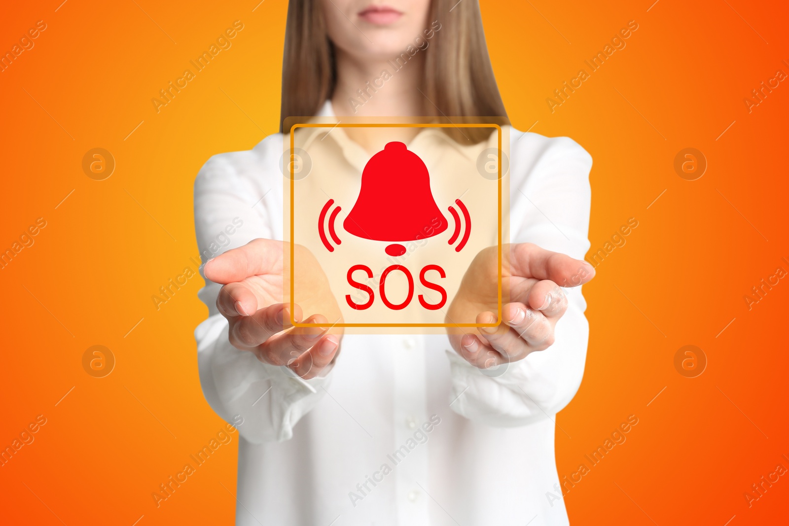 Image of Young woman holding virtual icon SOS on orange background, closeup