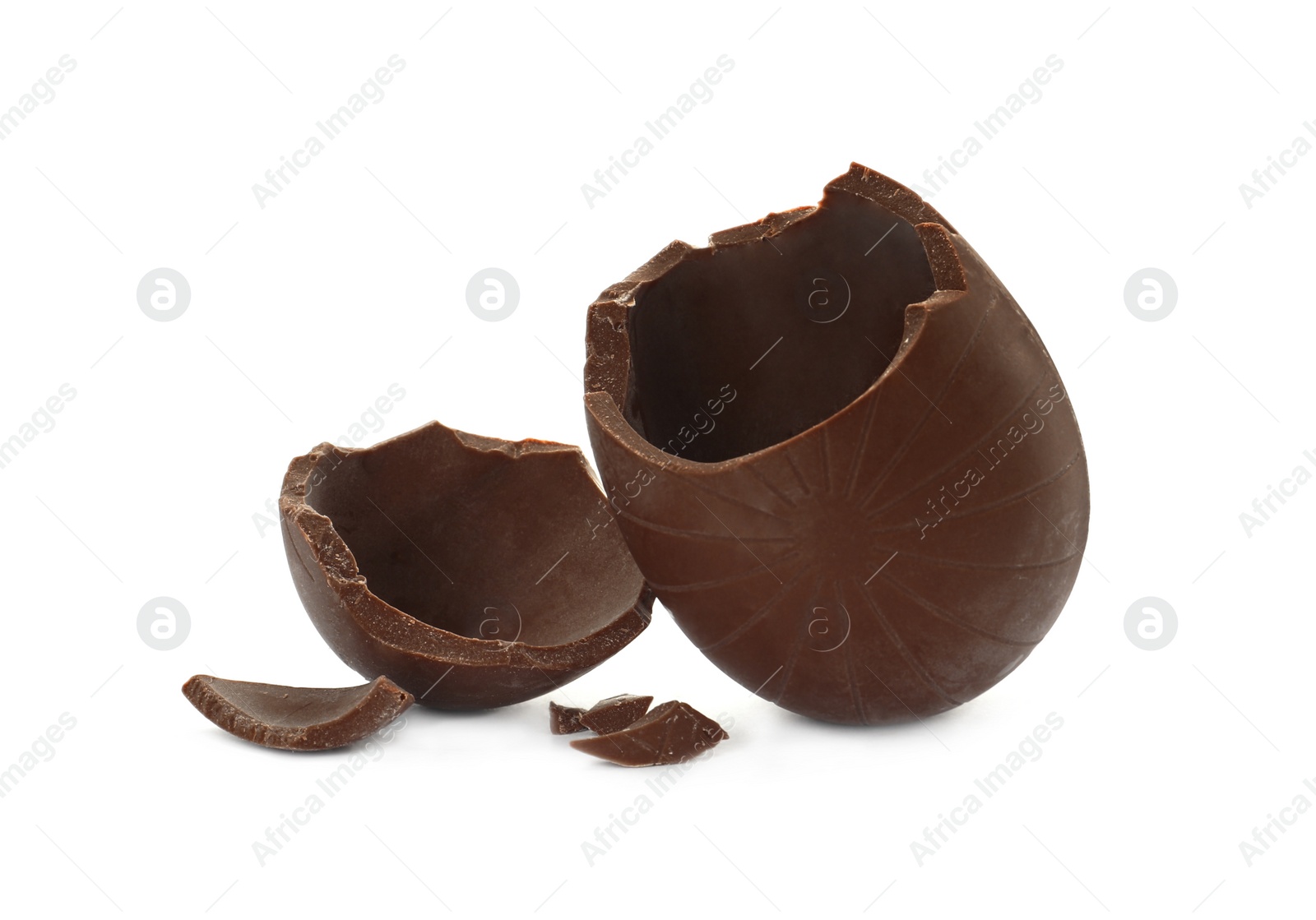 Photo of Broken milk chocolate egg on white background