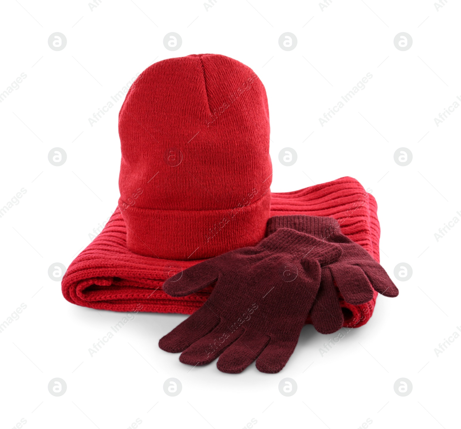 Photo of Woolen gloves, hat and scarf on white background. Winter clothes