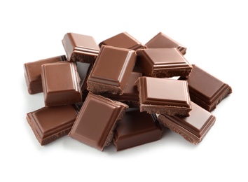 Photo of Pieces of tasty milk chocolate on white background