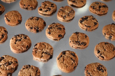 Photo of Many sweet delicious cookies on production line