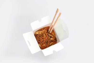 Chinese noodles in paper box, top view. Food delivery