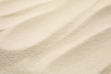 Uncooked organic semolina as background, closeup view