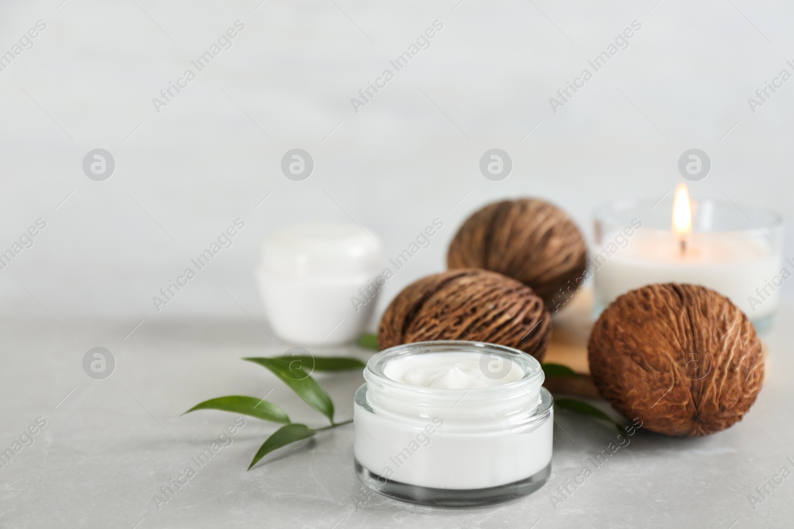 Photo of Beautiful spa composition with cream on marble table. Space for text
