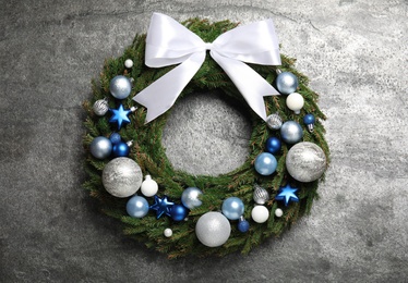 Beautiful Christmas wreath on grey background, top view