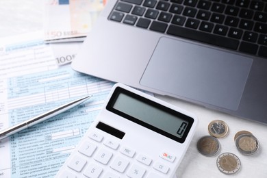Tax accounting. Calculator, money, pen, document and laptop on light grey table