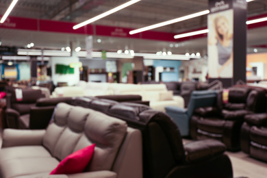 Photo of Blurred view of furniture store in mall. Bokeh effect