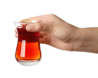 Woman holding glass of traditional Turkish tea on white background, closeup