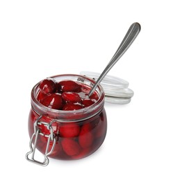 Photo of Delicious dogwood jam with berries and spoon in glass jar isolated on white