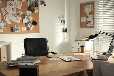 Detective office interior with big wooden desk