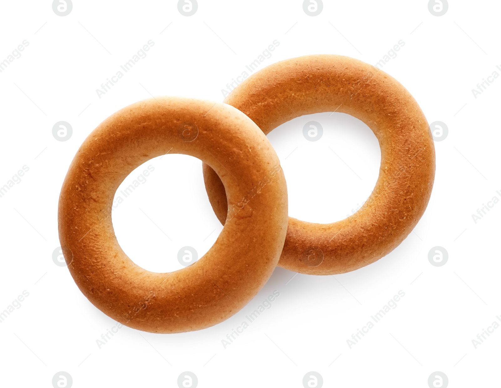 Photo of Tasty dry bagels (sushki) isolated on white, top view