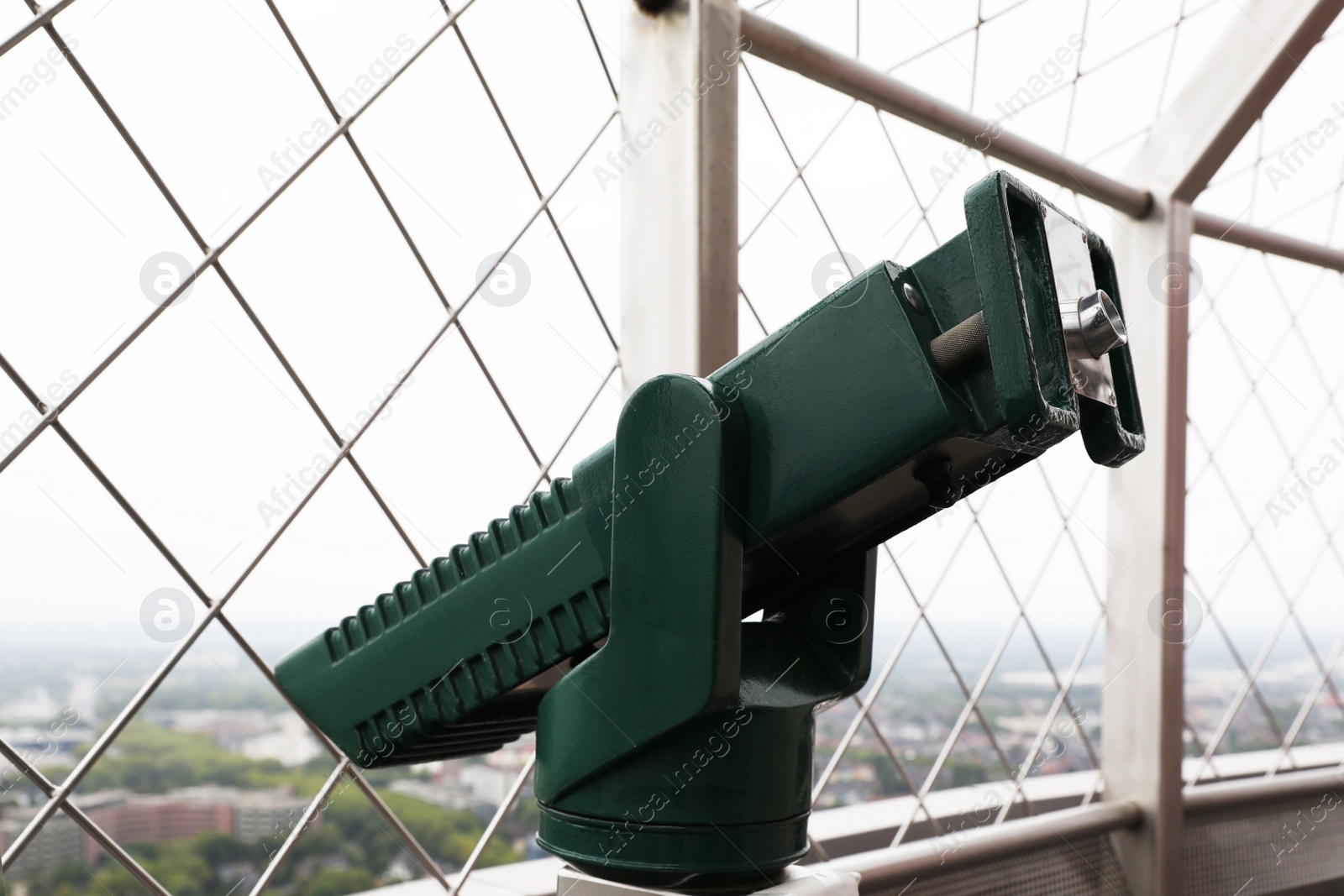 Photo of Green metal tower viewer on observation deck