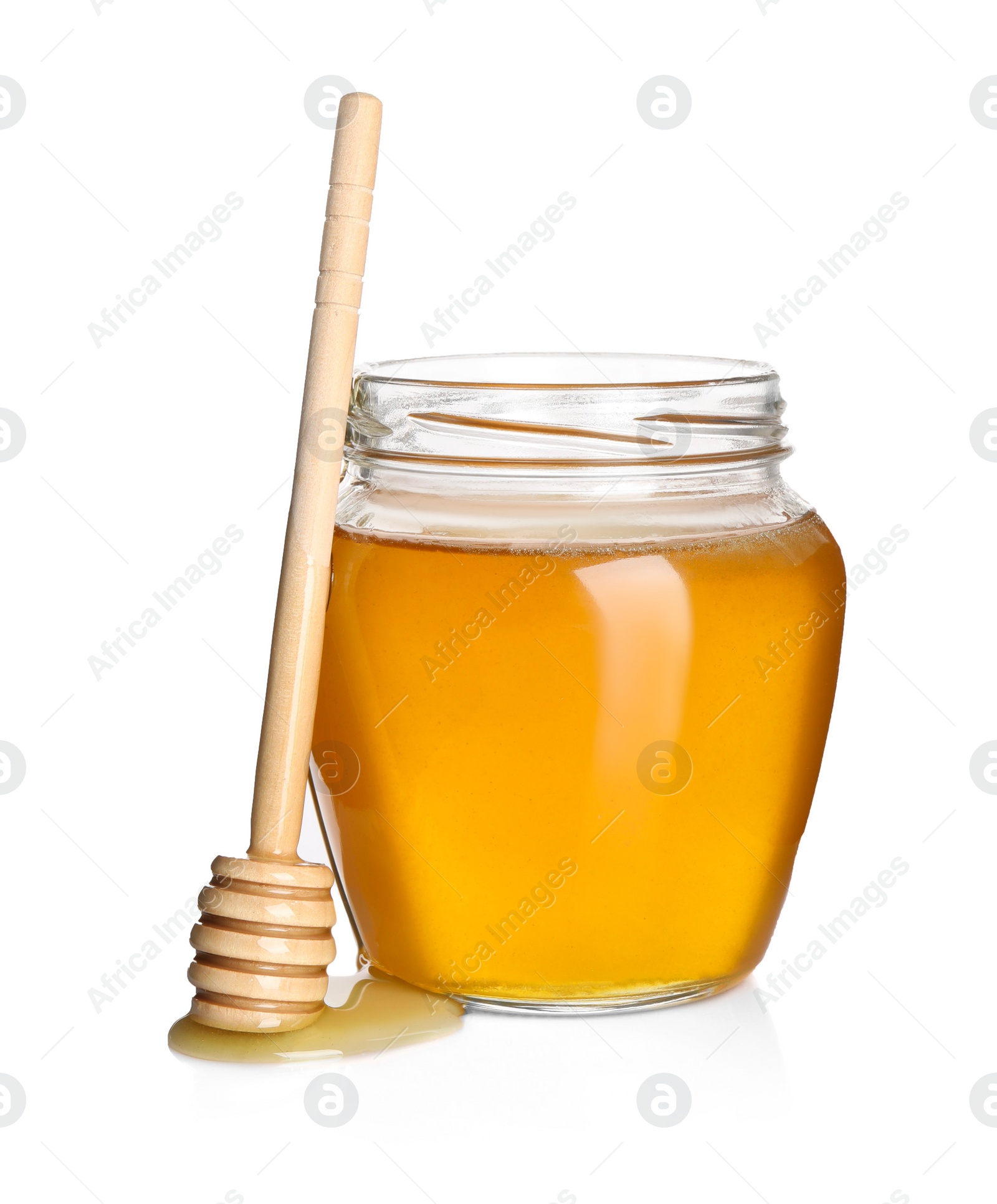 Photo of Tasty honey in glass jar and dipper isolated on white