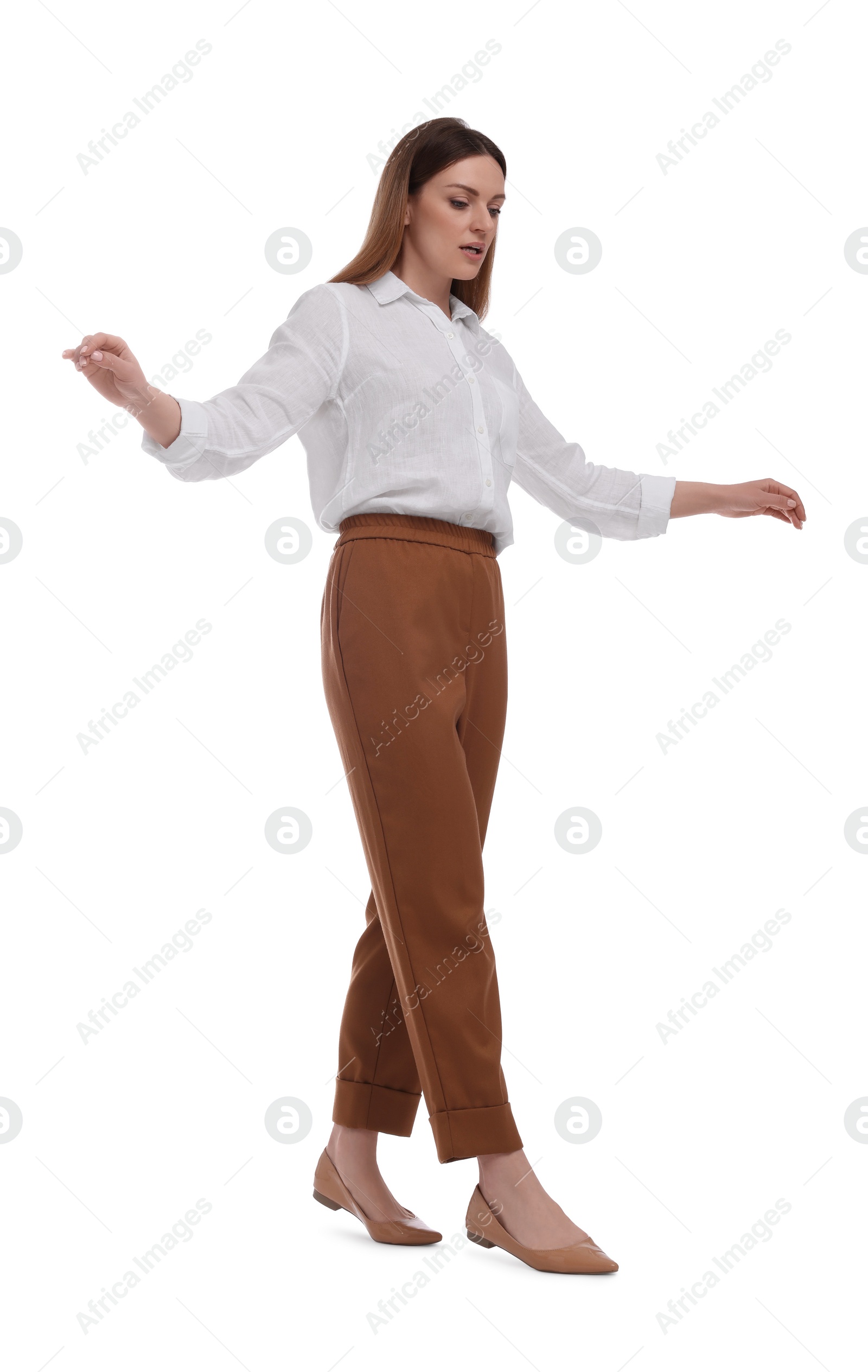 Photo of Beautiful happy businesswoman walking on white background