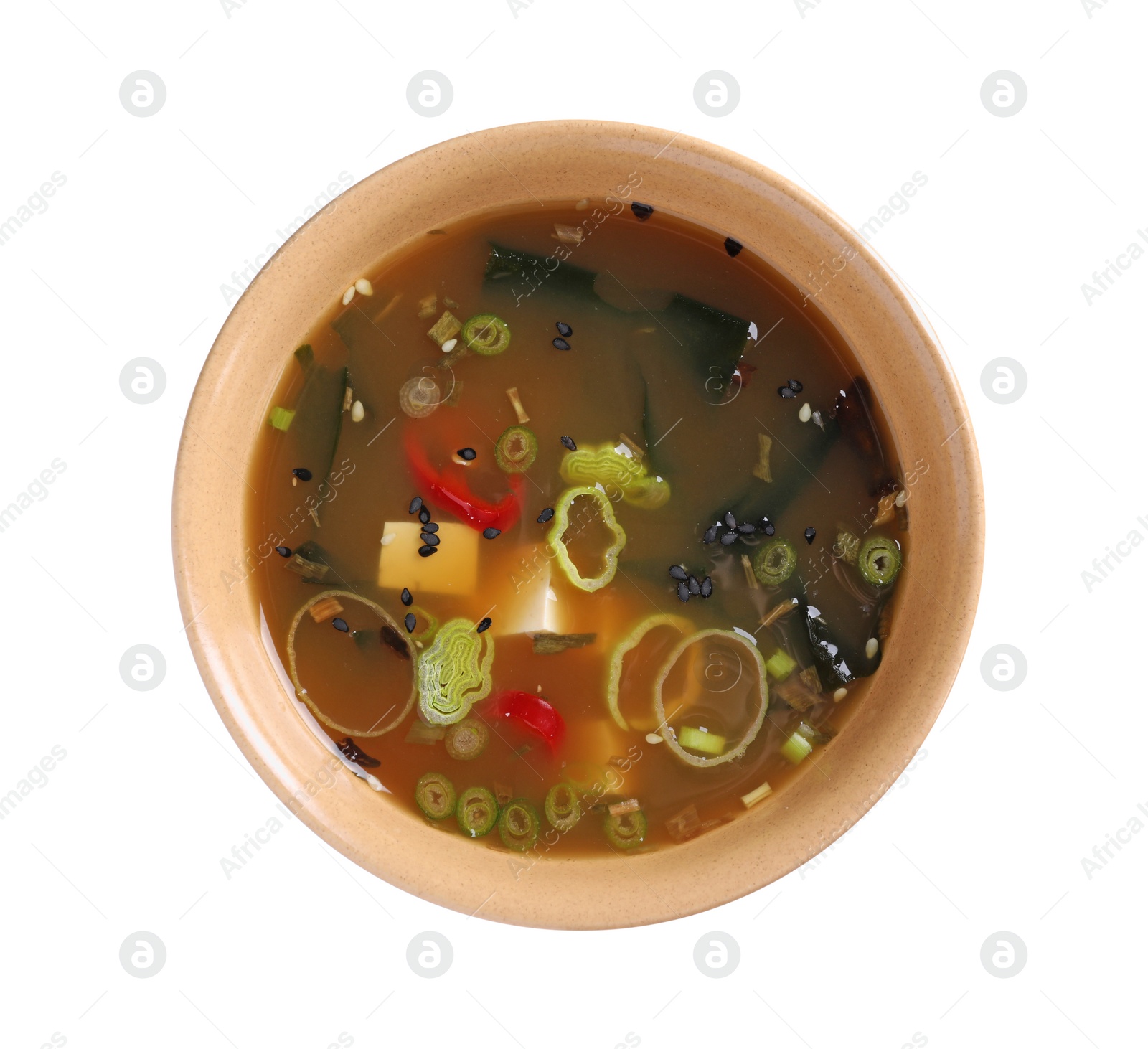 Photo of Bowl of delicious miso soup with tofu isolated on white, top view