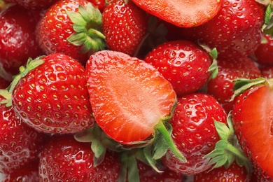 Photo of Heap of ripe red strawberries, closeup view