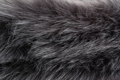 Photo of Texture of grey faux fur as background, closeup