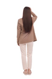 Businesswoman in suit on white background, back view