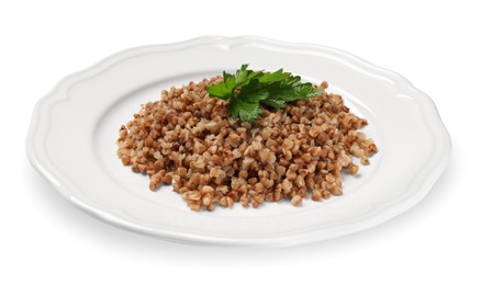 Photo of Plate with tasty buckwheat and fresh parsley isolated on white