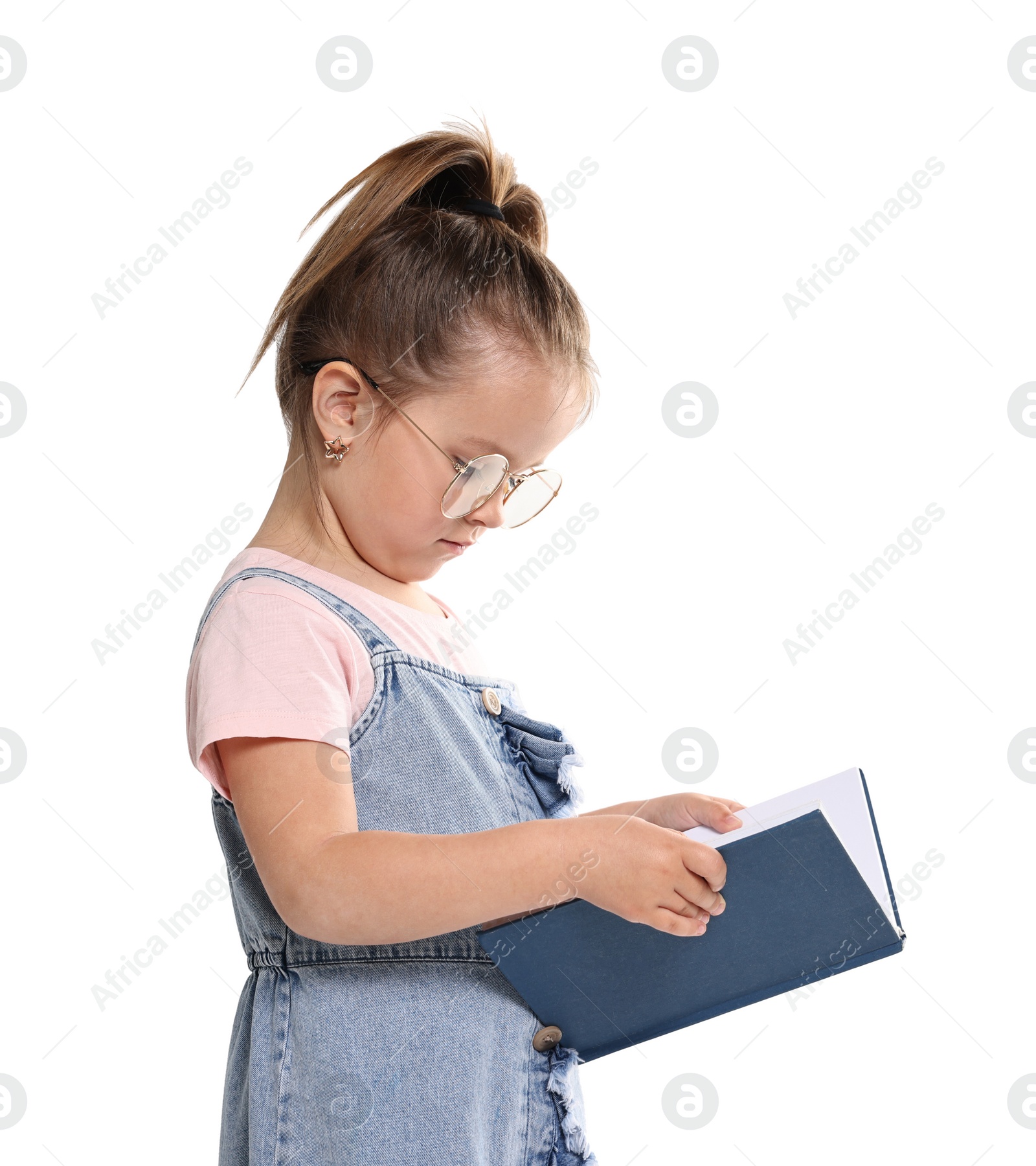 Photo of Cute little girl reading book on white background