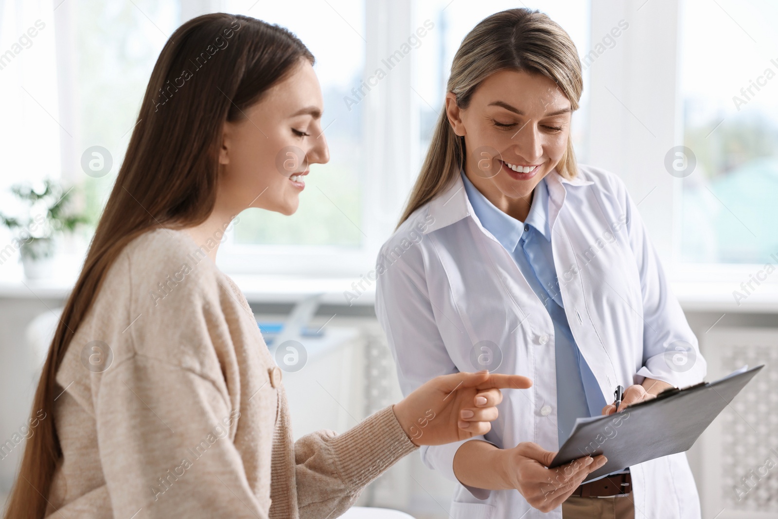 Photo of Professional doctor working with patient in hospital