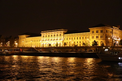 BUDAPEST, HUNGARY - APRIL 27, 2019: Beautiful night cityscape with illuminated Corvinus University