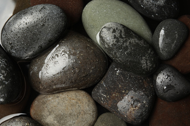 Pile of stones in water as background, top view. Zen lifestyle