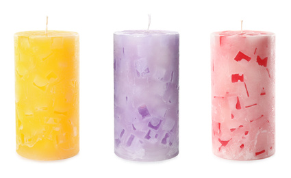 Set of color wax candles on white background