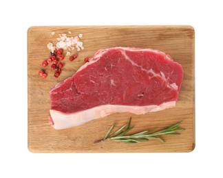 Board with steak of raw beef meat and spices isolated on white, top view