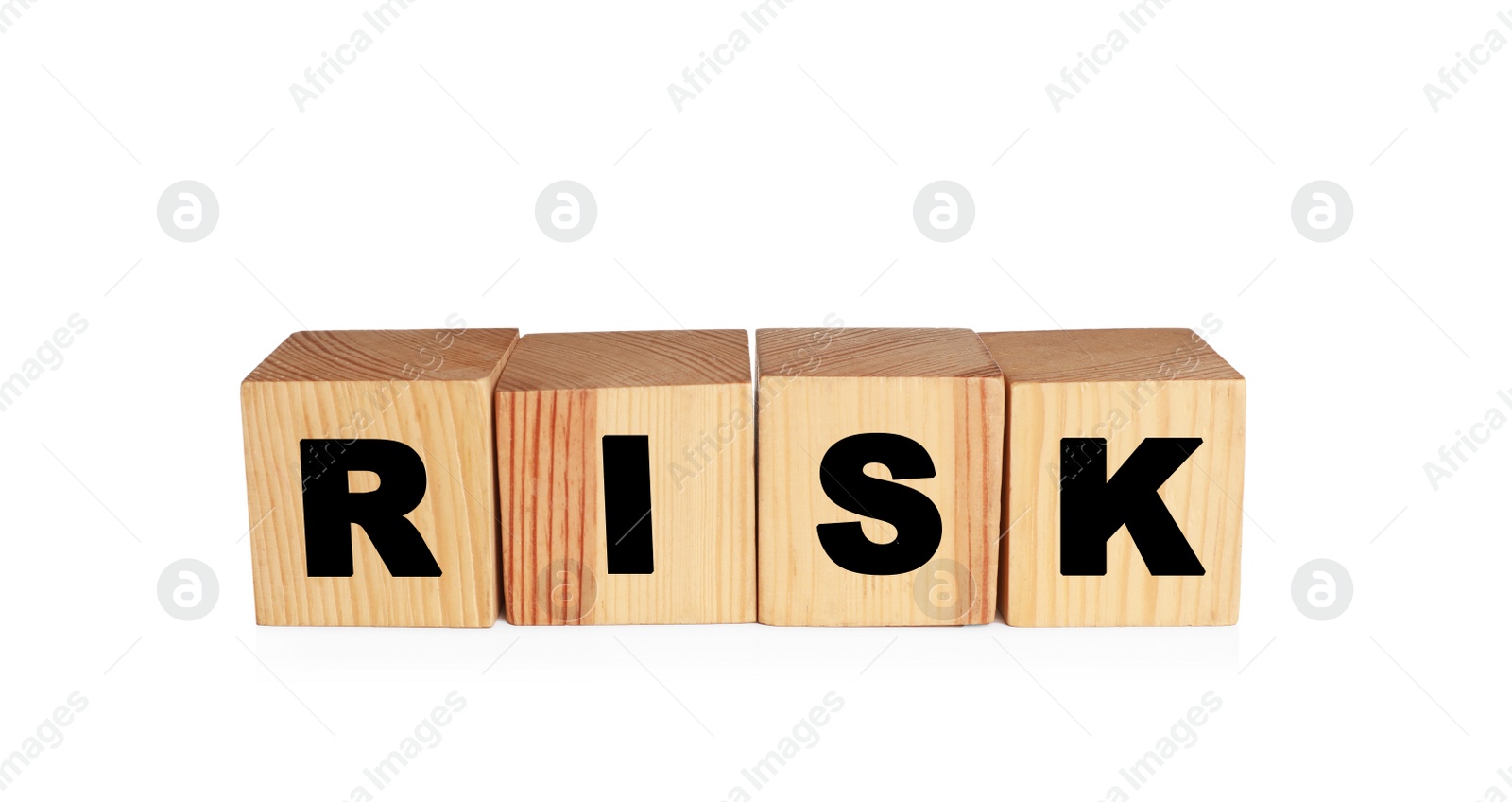 Photo of Word Risk made of wooden cubes on white background