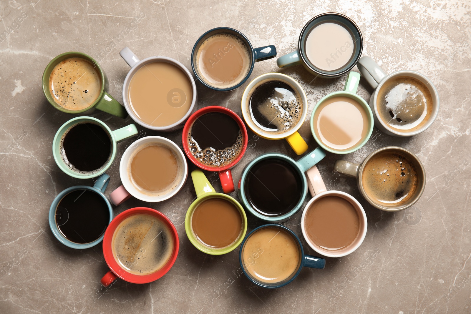 Photo of Flat lay composition with cups of coffee on gray background. Food photography